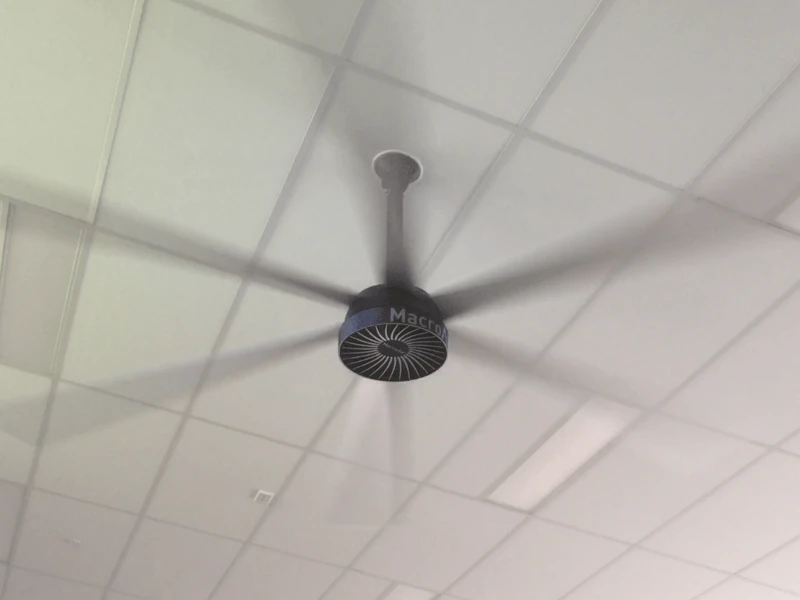 A ceiling fan whirring